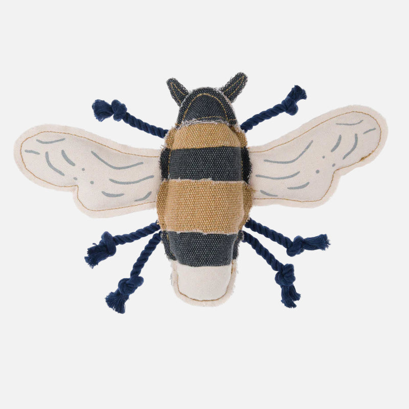 A bee-shaped dog toy with a navy body, beige and black stripes, and a textured surface, made from canvas fabric with rope legs.