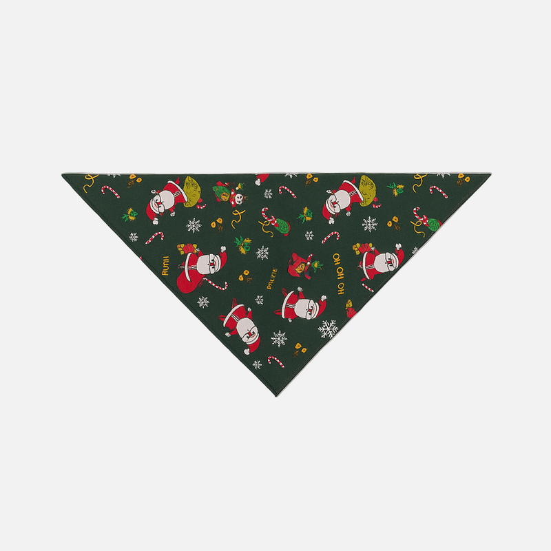 Christmas-themed dog bandana with Santa Claus and candy cane pattern on a green background