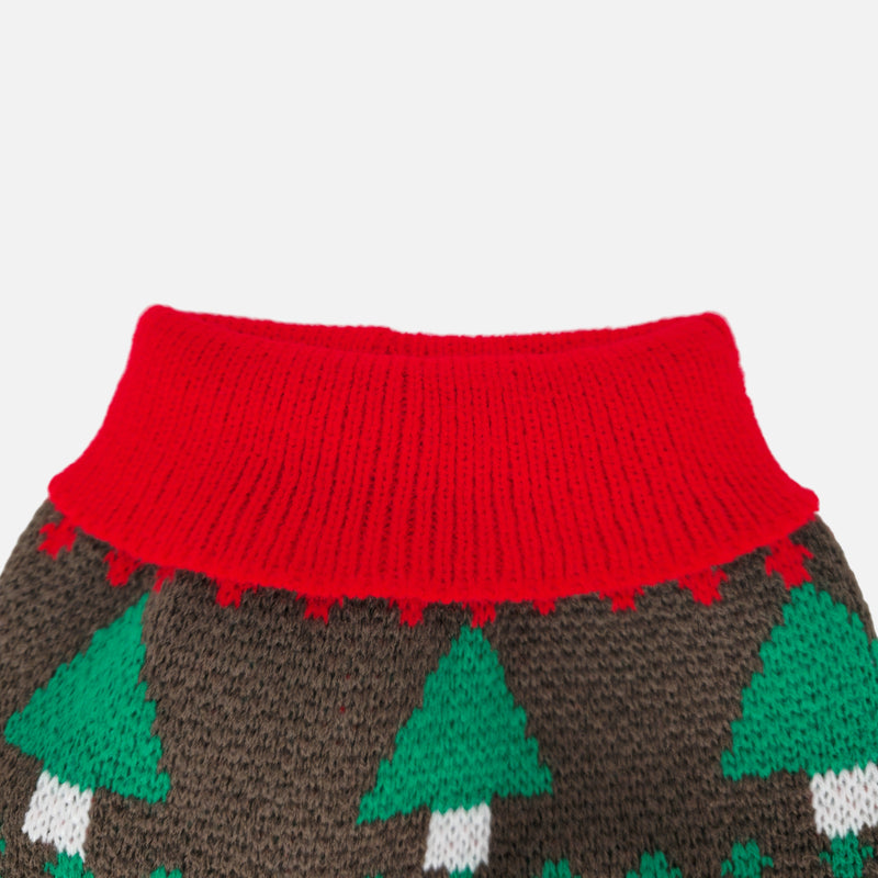 Knitted sweater with red collar and green tree pattern on a light gray background