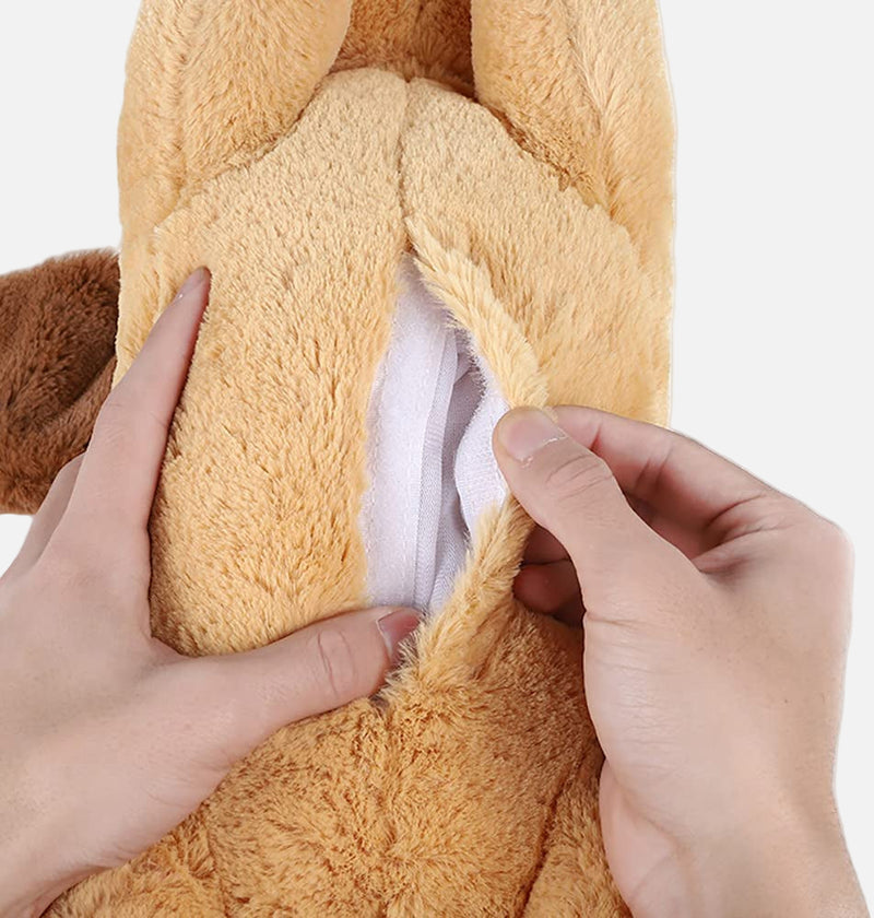 Close-up of a plush toy being held by two hands against a white background