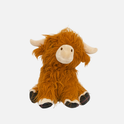 Plush toy resembling a highland cow on a white background