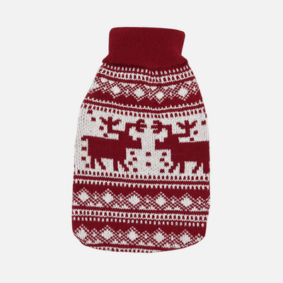 Red and white patterned dog sweater with reindeer design on a light gray background