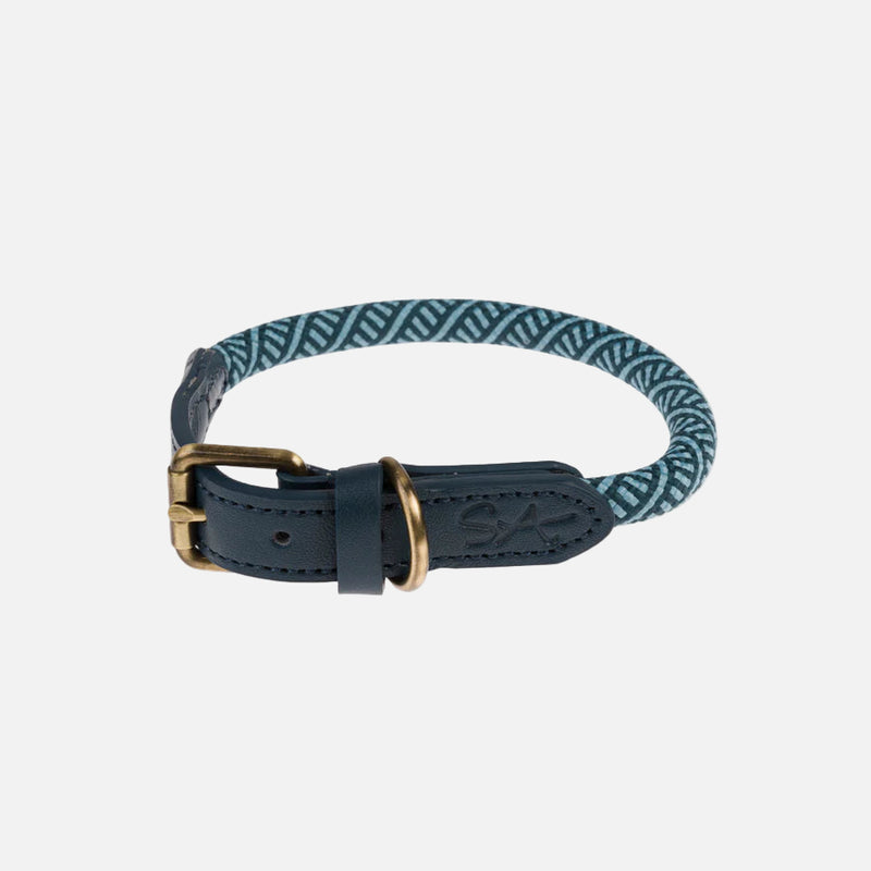 Navy blue dog collar with a gold buckle on a white background