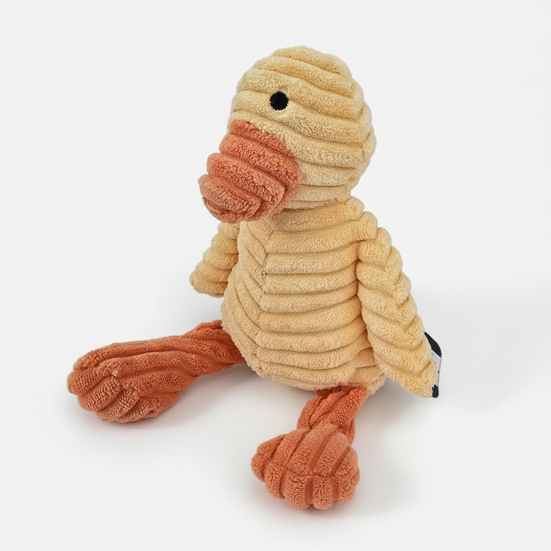 Plush dog toy with knitted texture on a light gray background