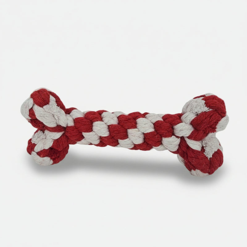 Red and white Christmas rope bone dog toy made from tightly woven cotton, designed for chewing and tug play.