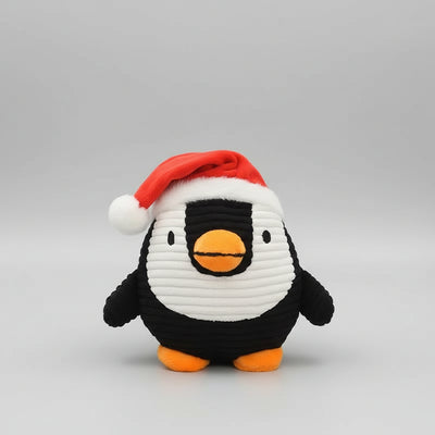 Corduroy penguin plush dog toy wearing a Santa hat, featuring a built-in squeaker for gentle indoor Christmas play.