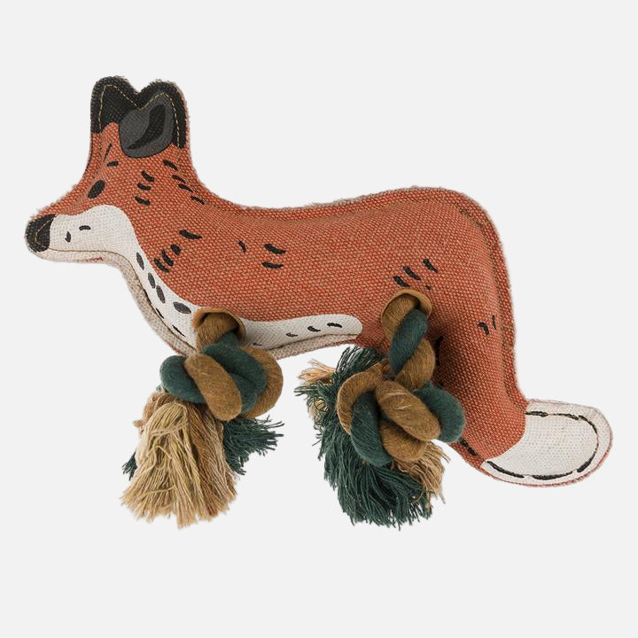 A fabric dog toy in the shape of a fox with rope legs in copper, white and black markings.